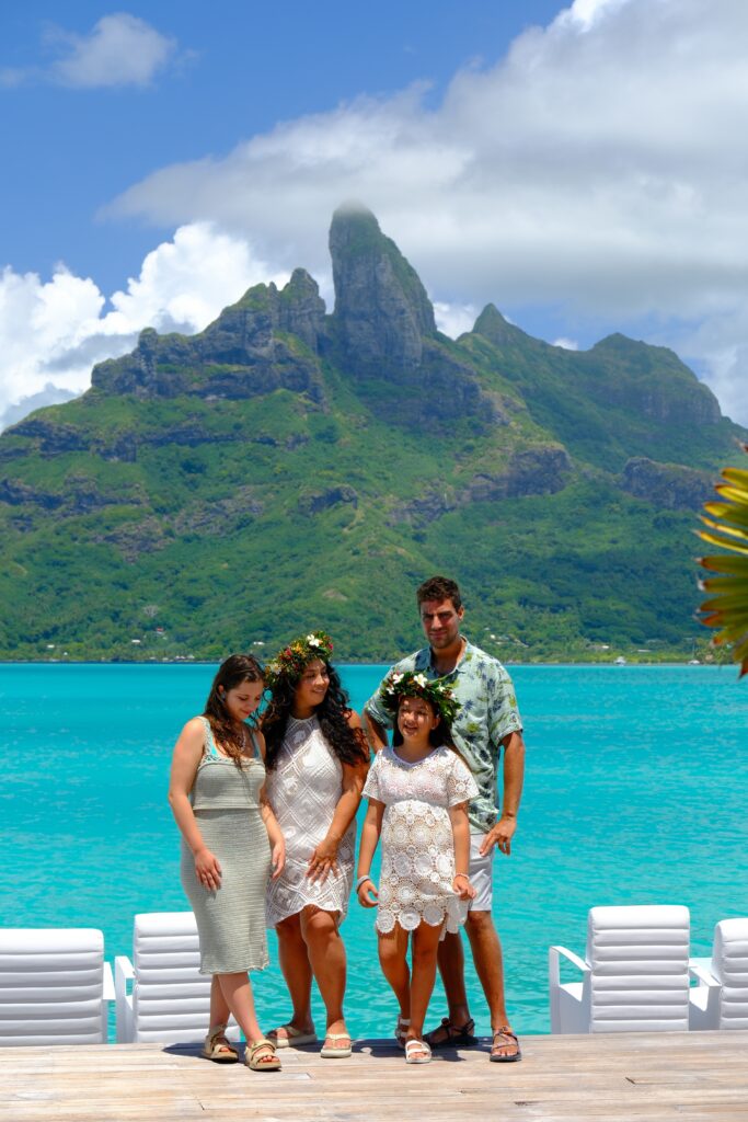 Salty Vagabonds family on the St. Regis Bora Bora deck with Mount Otemanu behind them, Amanda mid GLP-1 journey